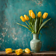 still life with yellow tulips in a vase on a petrol blue grunge wall background