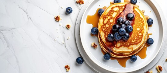 Aufkleber - Crepes or blinis or thin pancakes with blueberries hazelnuts and chocolate sauce on a white plate at white stone table Maslenitsa traditional Russian festival meal. with copy space image