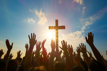 Wall Mural - Christians with hands raised in praise, worship and prayer to God at sunrise