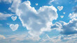 Heart shaped clouds in the blue sky. Valentine's day background.