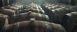 Atmospheric view of aged wooden barrels in a dimly lit cellar, hinting at timeless tradition.
