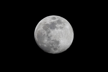 Wall Mural - photograph taken with a telescope of the full moon during winter. lunar craters in photo taken with 