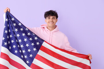 Wall Mural - Young man with USA flag on lilac background