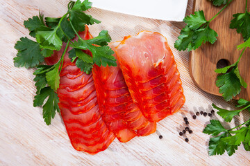 Wall Mural - Pork loin with black pepper and parsley on wooden table