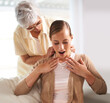 © Mapodile/peopleimages.com - Home, necklace and senior mother with woman for present, gift and surprise in living room. Family, pearls and happy daughter with mom giving heirloom on sofa for celebration, birthday and bonding