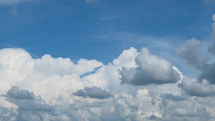 Wall Mural - blue sky with fluffy cloud time lapse on a sunny day 4k footage.