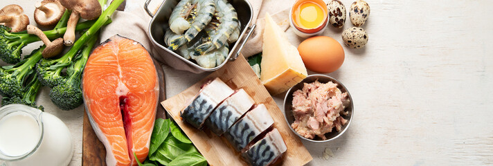 Wall Mural - Foods rich in natural vitamin D as fish, eggs, cheese, milk, butter, mushrooms, sardines.