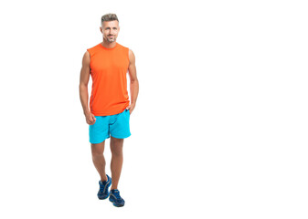 sporty athletic man in tshirt isolated on white. A standing athletic man at the gym studio. athletic man during a yoga class. athletic man posed on copy space before a fitness competition