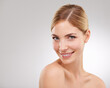 © Duncan M/peopleimages.com - Beauty, cosmetics and portrait of woman with smile for skincare, confidence and facial on studio mockup. Dermatology, healthy skin and face of girl on white background with care, space and wellness.