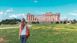 Woman tourist in Sicily visiting old ruins Greek temples at Selinunte- Travel, tourism, vacations in Sicilia island, Italy