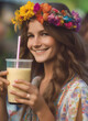Portrait of a young beautiful girl with a wreath on her head with a glass of smoothie. The girl smiles happily and leads a healthy lifestyle.