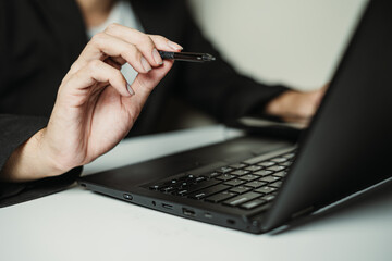 Hand of professional man pointing to the camera using stylus