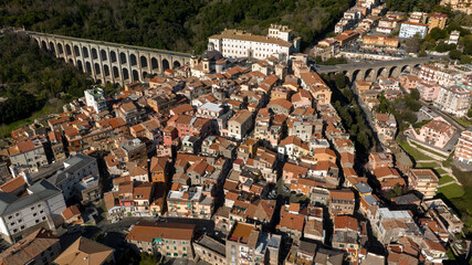 Wall Mural - Aerial view of the bridge and the historic center of Ariccia, in the Metropolitan City of Rome, Italy. The houses of the town are built between the traditional alleys on the hill near Italian capital.