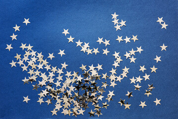 Poster - Abstract background with silver stars confetti glitter over blue background