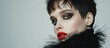 A stunning model with black hair and red lipstick poses confidently, showcasing her bold makeup and striking appearance.