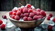 Red raspberries fruit in wood bowl on table