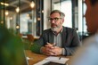 © Kevin - Middle aged mature older business man hr manager, lawyer, bank adviser having work conversation at office meeting or job interview. Financial legal advisory and consultancy services, Generative AI
