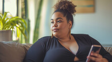 fashionable portrait of a plus size woman with smartphone 
