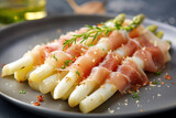 Fototapeta Sawanna - cooked white asparagus with ham and sauce. AI generative.