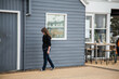 © Austockphoto - Teen girl walking next to harbour side buildings in Newcastle on overcast day