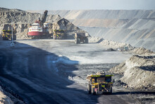 Dump Trucks Filling Up With Overburden And Carting It Through Open Cut Coal Mine