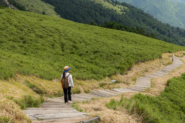 Canvas Print - Hike trail hiker woman walking over the mountain