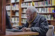 © DesignzByLA - Elderly Man Researching on Computer in Library