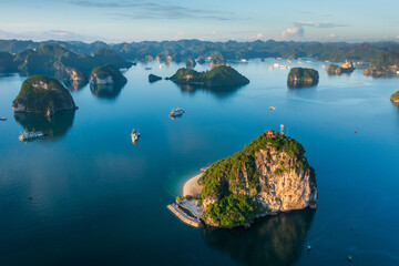 Wall Mural - Aerial view of Ha Long Bay during sunrise and beautiful day, blue clear sky. Vietnam tourist attraction