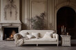 Luxury, beige sofa in a classic interior with a fireplace and candles.