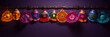 vibrant colorful mexican paper picado banners hanging on purple wall