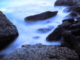 Fototapeta Londyn - Beautiful landscape seacost with rocks at the sunny day new world long exposure
