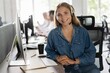 © opolja - Young friendly operator woman agent with headsets working in a call center.