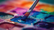 A detailed shot of a watercolor palette with a variety of vibrant hues a paintbrush lightly touching the surface of the water blending colors The