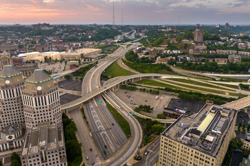 Poster - Cincinnati, Ohio transportation infrastructure. View from above of American big freeway intersection at sunset with fast moving cars