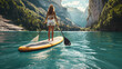 © slonme - Woman Paddleboarding on a Serene Mountain Lake