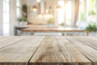 © Pacharee - Empty wood table and blur modern kitchen interior background.