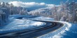 A solitary journey through a wintry wonderland, as the winding road leads towards the majestic mountains amidst the freezing air and snowy landscape