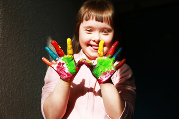 Wall Mural - Cute little girl with painted hands