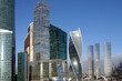 Moscow City International Business Centre dense standing high skyscraper buildings against cloudless blue sky