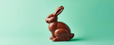 Fototapeta Do akwarium - Chocolate Bunny Delight: Sweetness on pastel Background with Copy Space
