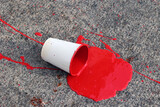 Fototapeta  - Kubek farby. Czerwona plama na chodniku. Krwawa plama.