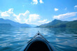 Riding a canoe on a lake surrounded by high mountains