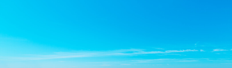 Wall Mural - small clouds in the blue sky in spring