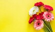 bouquet of gerberas on yellow background top view flat lay holiday greeting card happy moter s day 8 march valentine s day easter concept copy space mock up