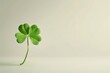 © Елена Григорова - Single clover leaf on off-white background, green, St. Patrick's Day, Irish symbol, simplicity, minimalism