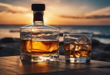 Bottle And Glass Of Whisky On A Table With Beach Sea And Sunset In Background
