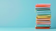 Stack Of Colorful Folders On A Light Blue Background
