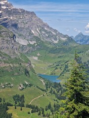 Poster - a view of the mountain range and its surrounding lakes and trees