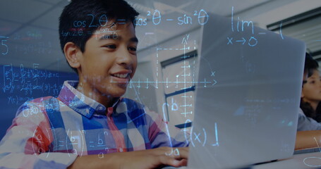 Poster - Image of mathematical equations over schoolboy using laptop in classroom