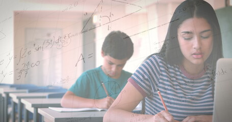 Poster - Image of mathematical equations over schoolgirl using laptop in classroom